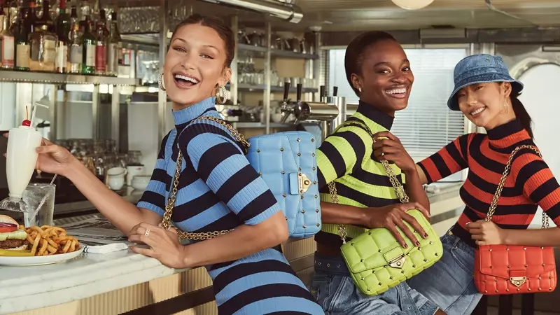 Model Bella Hadid, Mayowa Nicholas, dan Heejung Park berpose untuk kampanye musim semi-musim panas 2021 MICHAEL Michael Kors.