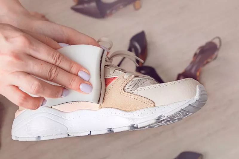 Woman Brushing Sneakers Sponge