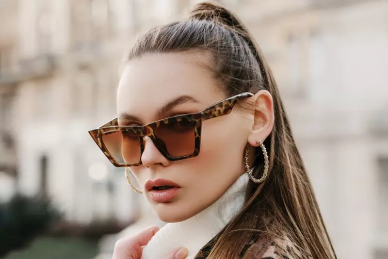 Closeup Model Hoop Earrings Animal Print Sunglasses