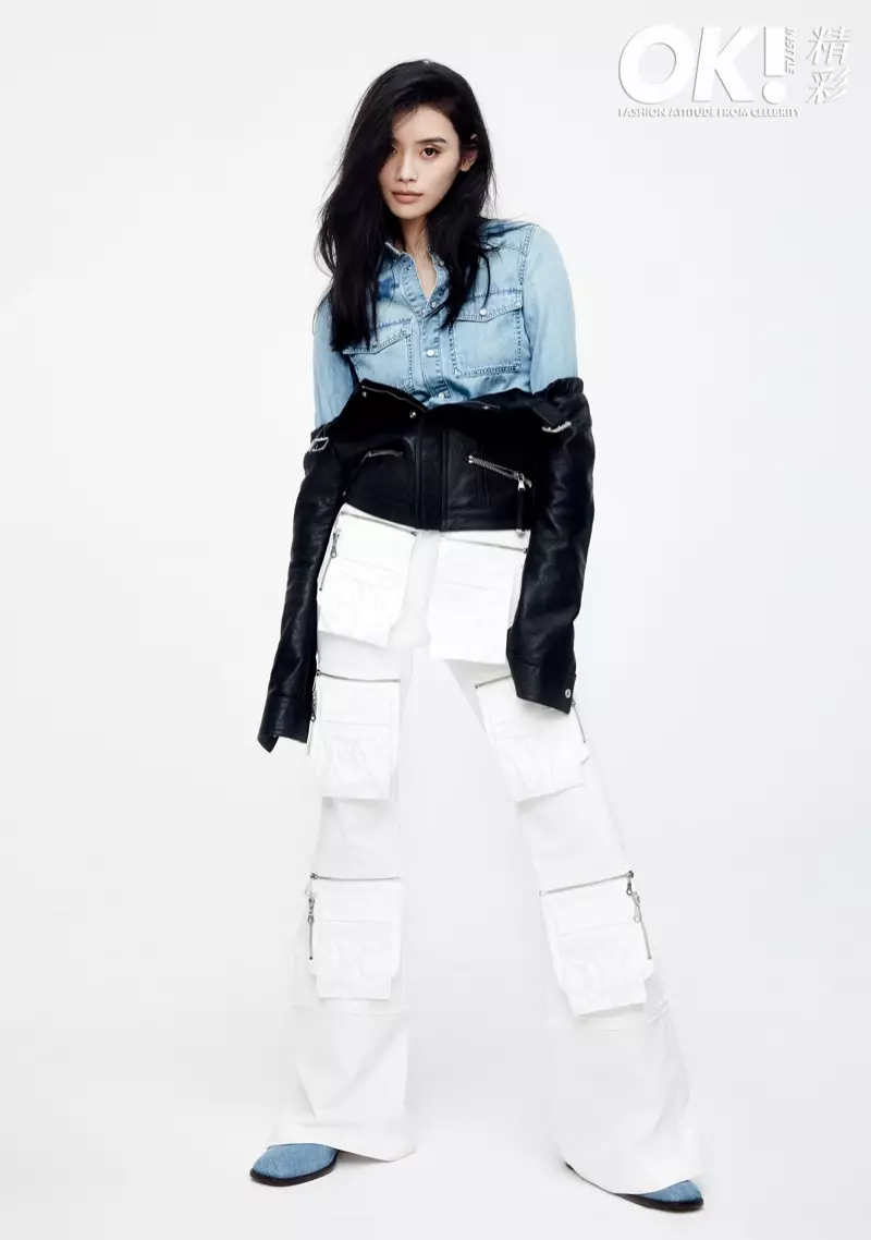 Model Ming Xi dra denimhemp, leerbaadjie en ritsbroek