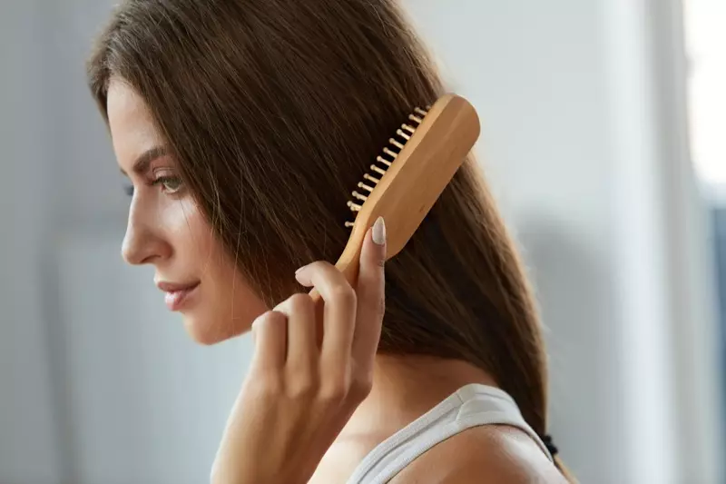 Woman Brushing Hair Closeup