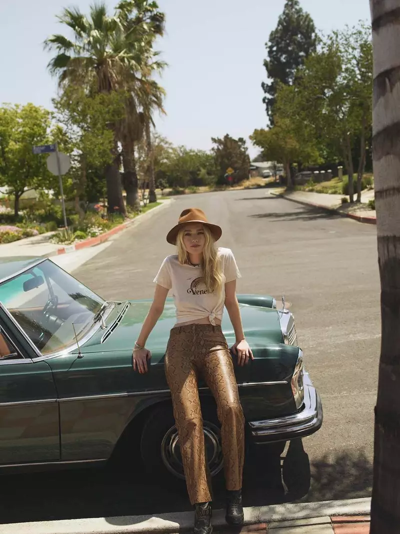 Posing sa labas, Dakota Fanning models Zimmermann t-shirt, Nili Lotan flared pants at Ganni boots