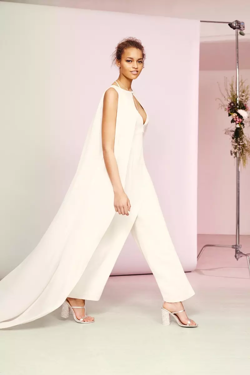 Nakasuot ang modelo ng ASOS Bridal Jumpsuit at Cape