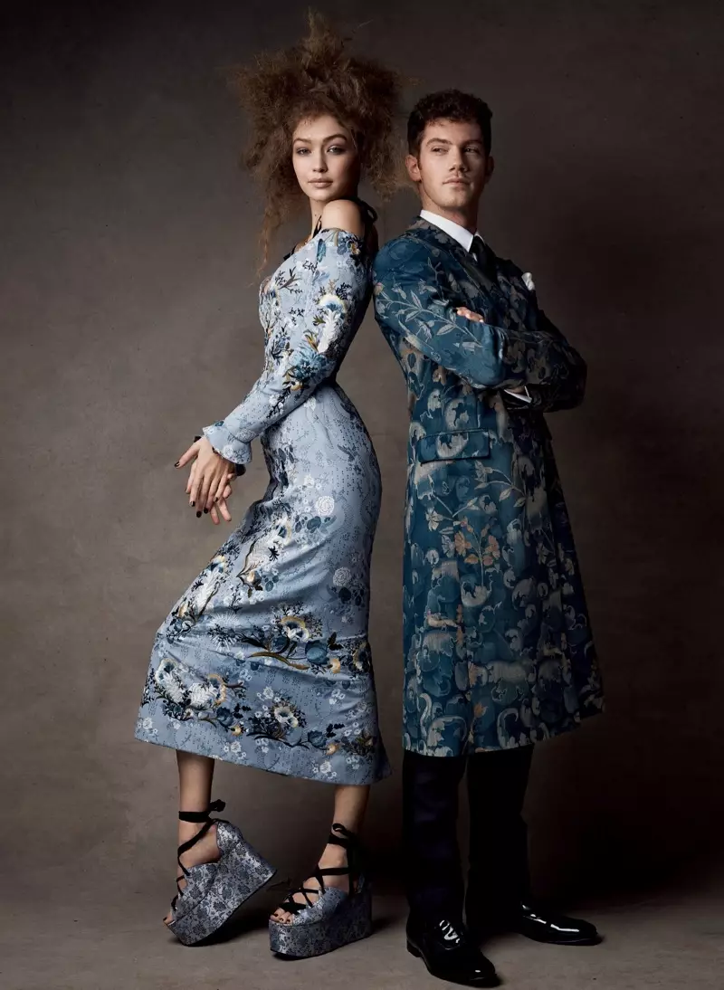 Kledd i en Erdem-kjole og plattformsandaler, modellerer Gigi Hadid sammen med Alistair Brammer