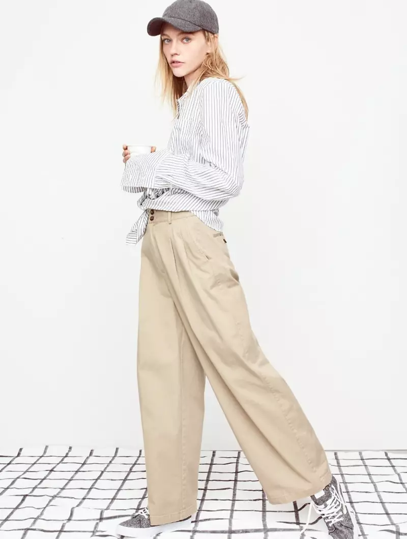 Madewell Bristol баскычтуу сызыктагы көйнөк, кең буттуу хаки шым, жүн аралаштырылган бейсбол капкагы жана марледен жасалган кездемеден жасалган Vans Sk8-Hi бийик кроссовкалары