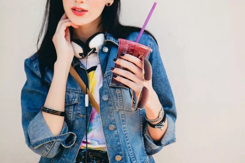 Model Denim Jacket Holding Drink Sunglasses