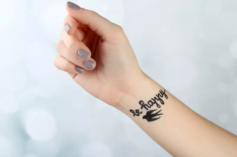 Maging Happy Bird Tattoo